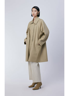 Model wearing JNBY Trench Coat styled with ankle boots