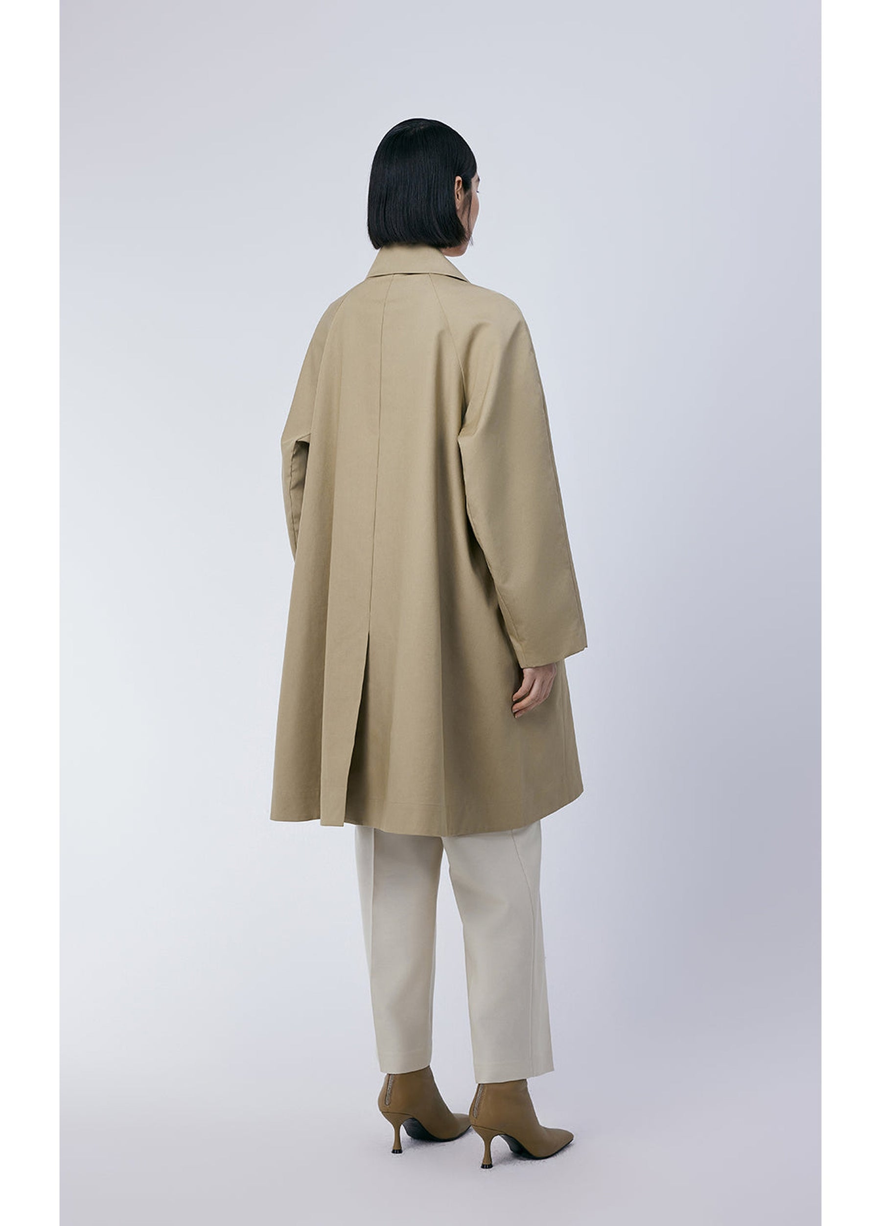 Back view of JNBY Relaxed Trench Coat with flowing A-line design