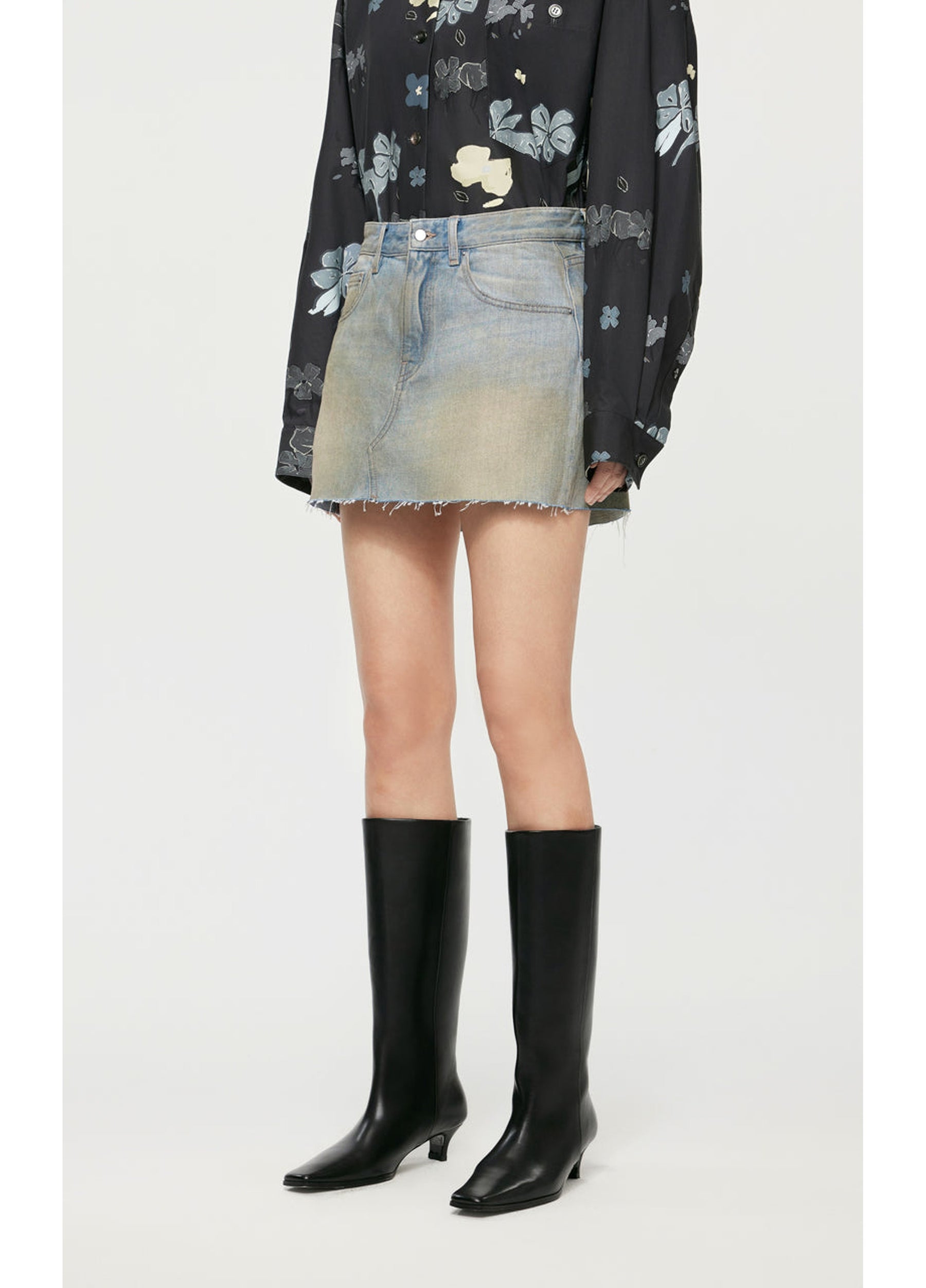 Side view of JNBY A-Type Denim Skirt highlighting its A-line flow.