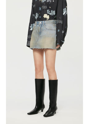 Side view of JNBY A-Type Denim Skirt highlighting its A-line flow.